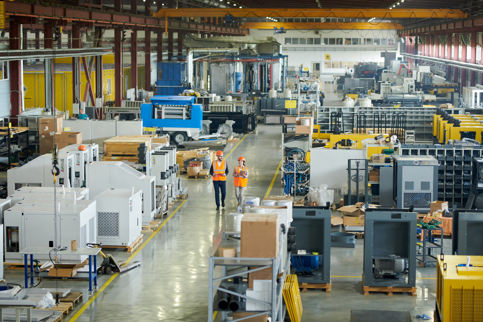 Manufacturing facility with industrial equipment and workers